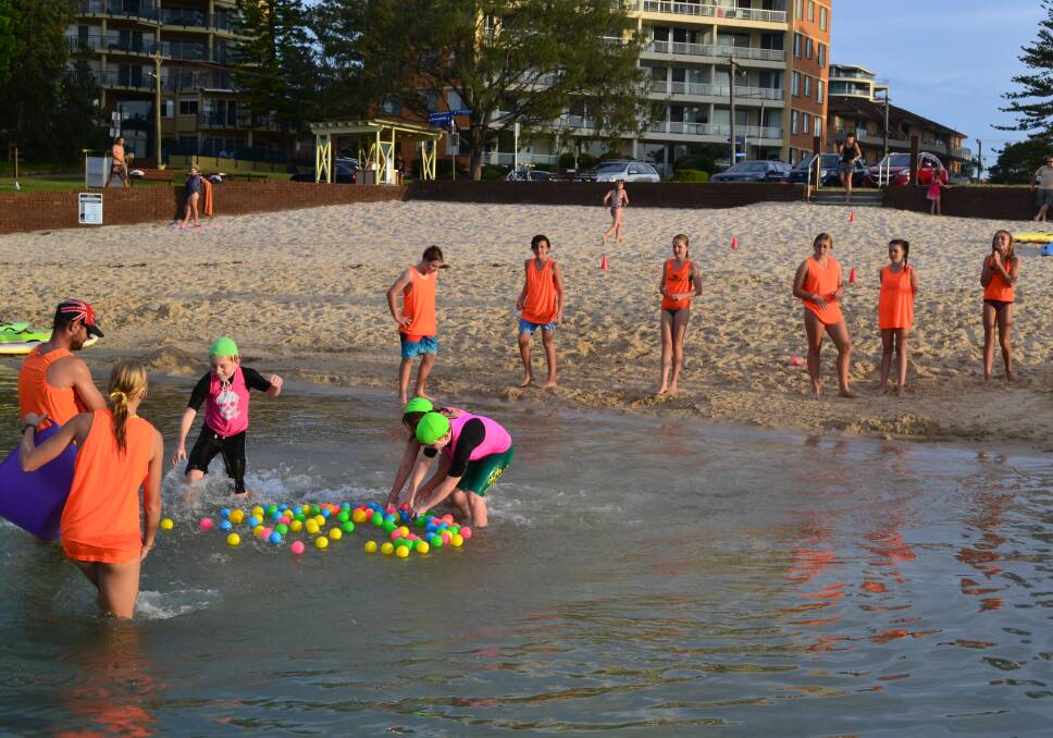WATER GAMES: Forster Surf Club’s Youth Group members conducted a surf education program at the Bullring at Main Beach recently for children living with a disability.  
  