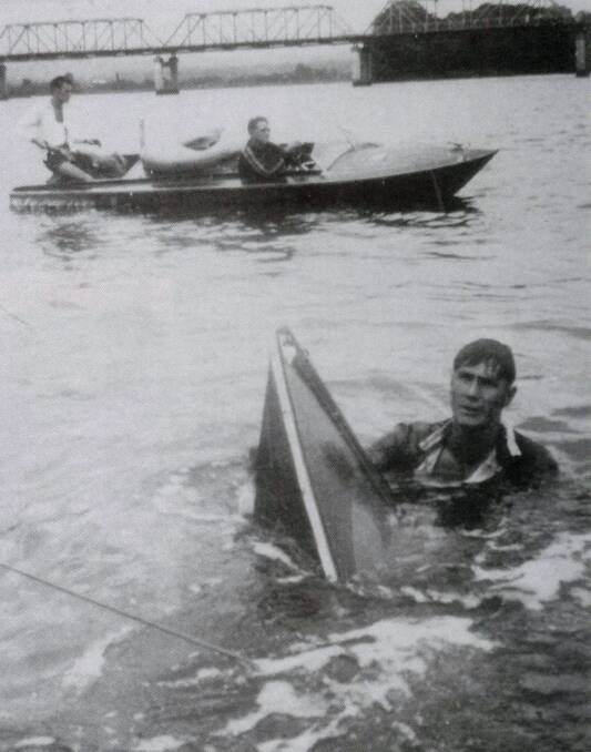 LUCKY SAVE: Fred Williams trying to retrieve "Betty" Harry Alcom's boat from a capsize at Taree. 