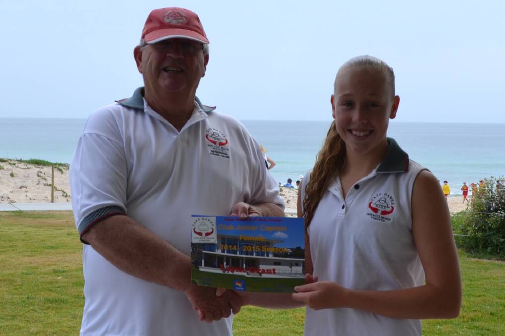 YOUNG LEADER: Cape Hawke Surf Life Saving Club member Layne Grant is congratulated by club president Paul Scott on her appointment as junior captain. 
