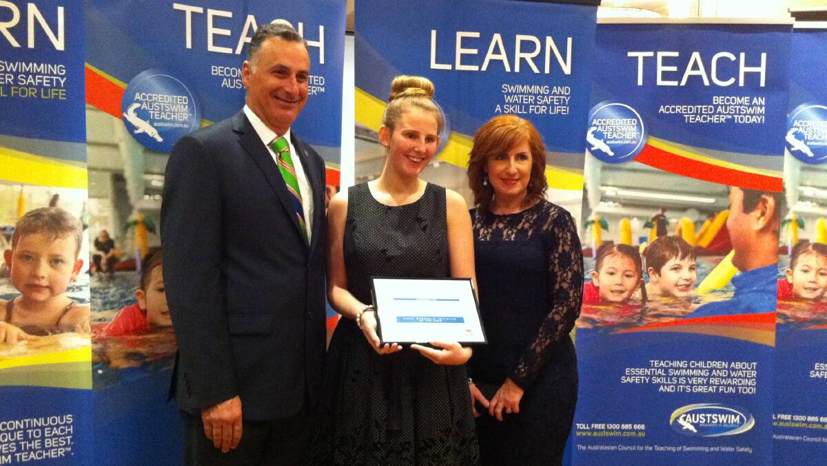 SURF EDUCATION:  Forster Surf Life Saving Club received a commendation for Local Community Initiative of the Year for their Surf Awareness School driven by Laura Thurtell. Pictured are the club’s junior club captain Ruby Jones and secretary Sheridan Carroll Jones receiving the award from Member for Drummoyne John Sidoti. 
 
