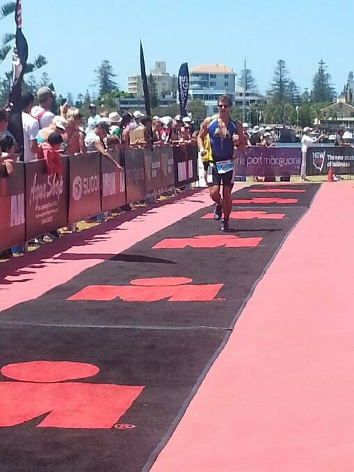 RACING IN PORT: Forster Triathlon Club member Samuel Newman competing in the Ironman 70.3 Port Macquarie.  