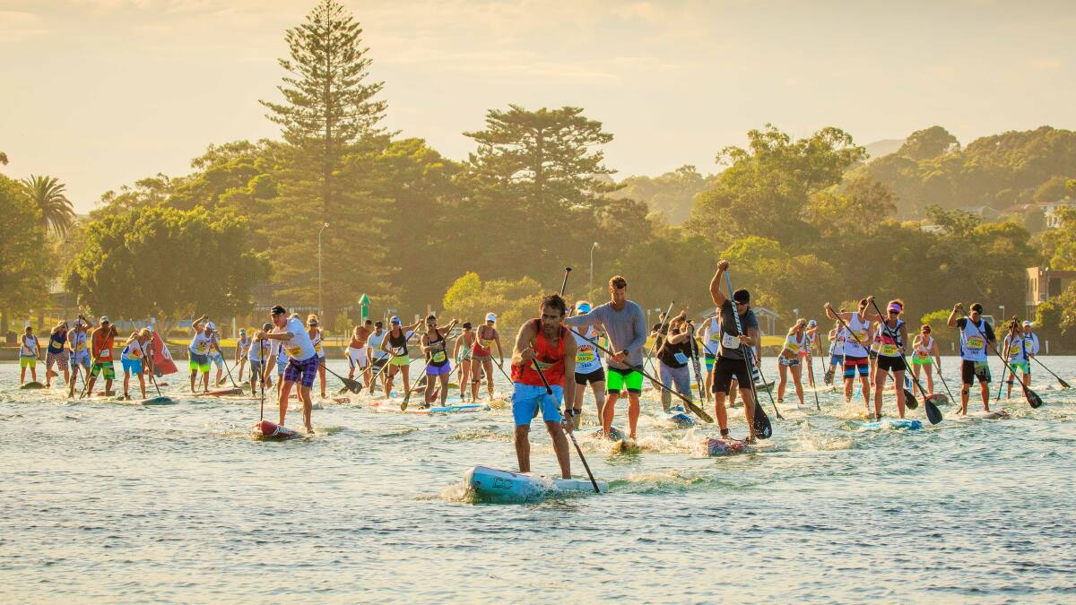 OUT IN NUMBERS: Competitors setting off on Wallis Lake on Sunday morning for the 5km stand up paddle board (SUP) race. The Forster Island 
Paddle Festival broke the record for the largest SUP event in Australia with 273 people registered across all categories.  Photo by Adam Scard.    