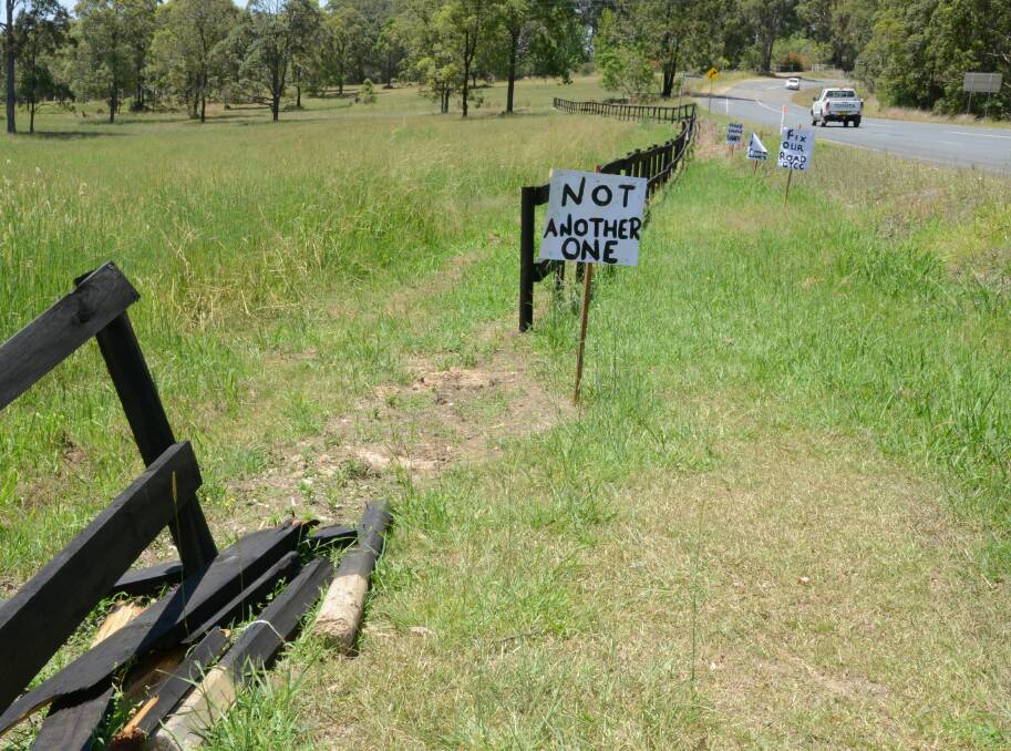 Signs were erected along the infamous stretch of The Lakes Way at Rainbow Flat calling for Taree Council to take immediate action after an accident in January. 