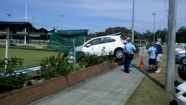 WHOOPS: A woman aged in her eighties wedged her car onto the Forster Bowling Club’s green on Monday morning when she mistakenly hit the accelerator instead of the brake.  Photo by Dan Stepanovich. 