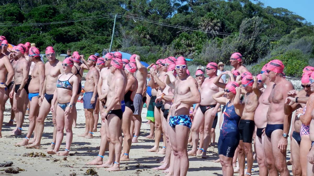 CROWD OF EAGER SWIMMERS: Participants line up for the start of the Pacific Palms Real Estate Rock to Rock Ocean Swim on Sunday. 