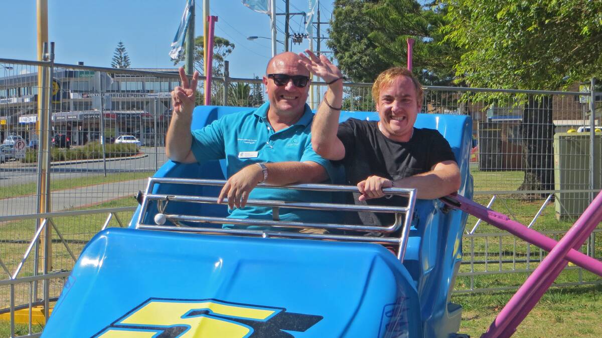 Great Lakes Council’s Ageing and Disability Services client services officer Bruno Puglisi and Keegan Rees enjoying one of the rides. 
