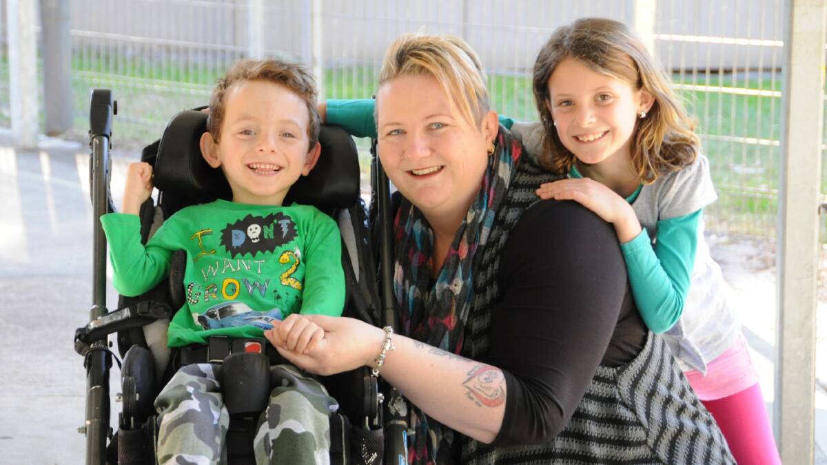 GRATEFUL: Sandy Robertson with her five-year-old son Griffin who has severe cerebral palsy and her nine-year-old daughter Laci. The family experienced their first holiday last year after staying at Wheeling and Able’s purpose-built unit in Port Stephens.  
