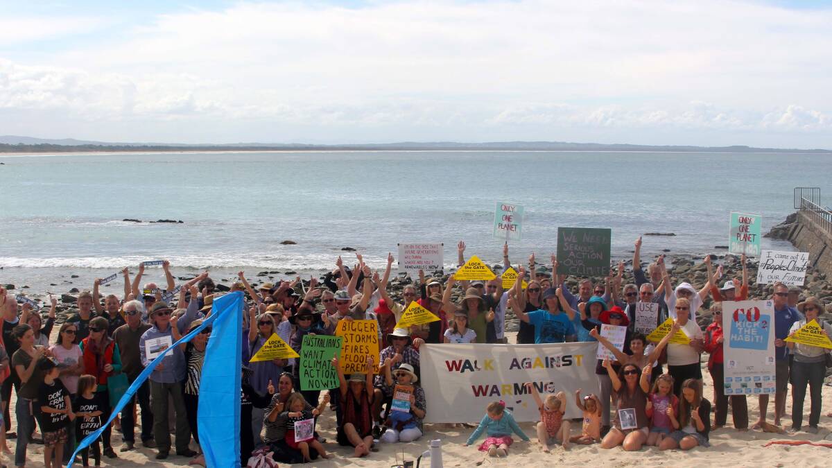 DAY OF ACTION: Around 100 people gathered at Main Beach on Sunday as part of the global day of action calling for meaningful action on climate change.   Many carried signs from previous years - a reminder that the community has been campaigning for the phasing out of fossil fuels for many years.
