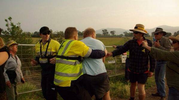 File photo by Kate Ausburn of a scuffle between AGL security guards and protesters last week at Gloucester.