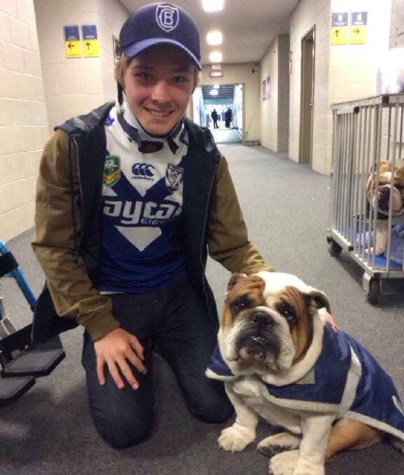 GREAT NIGHT: Curtis had a night out at ANZ Stadium where he was presented with a cheque from Jaycar and got to meet Chase the bulldog. 