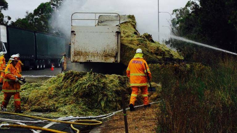 A truck load of hay caught alight this afternoon closing all northbound and one southbound lane north of Nabiac.  Photo by Becca Kym
