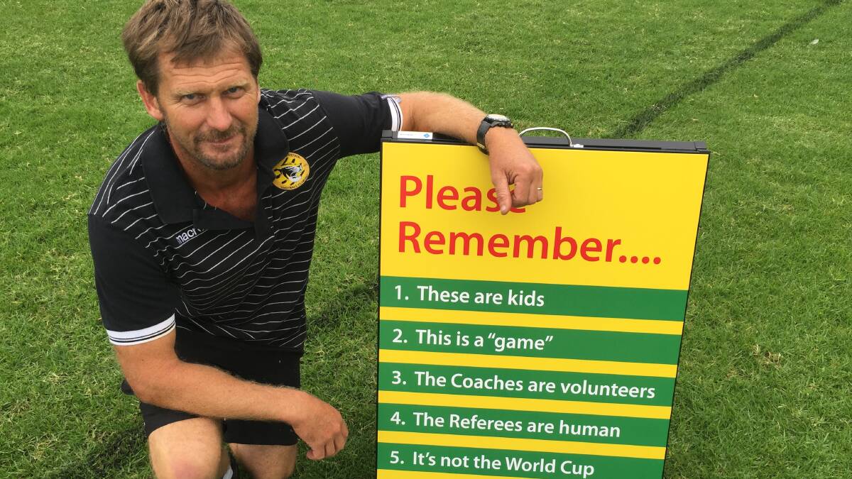 Tuncurry Forster Football Club vice president and coach Scott Fletcher is confident the new a-frame sign will remind parents and supporters of what junior football is about.