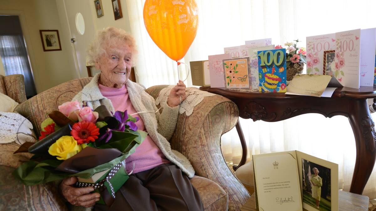 POPULAR CENTENARIAN: Ivy Ravell surrounded by gifts and cards at her home in Forster for her 100th birthday. She still lives at home where she cooks and gardens regularly.  