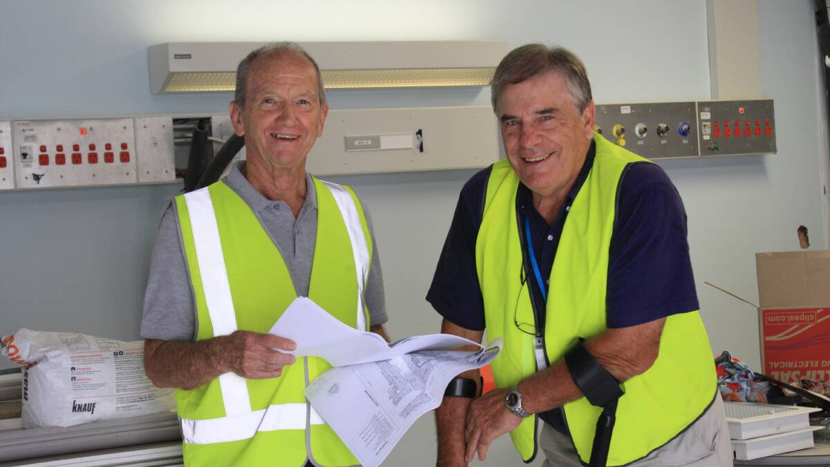 UNCERTAIN FUTURE: Cape Hawke Community Hospital and Health Association board member Graham Burns and chairman Roger Lynch on site where a proposed dialysis unit at Forster Private Hospital is being built. The unit is due to be complete next month but its future use is still being determined by hospital management and Hunter New England Health. 
