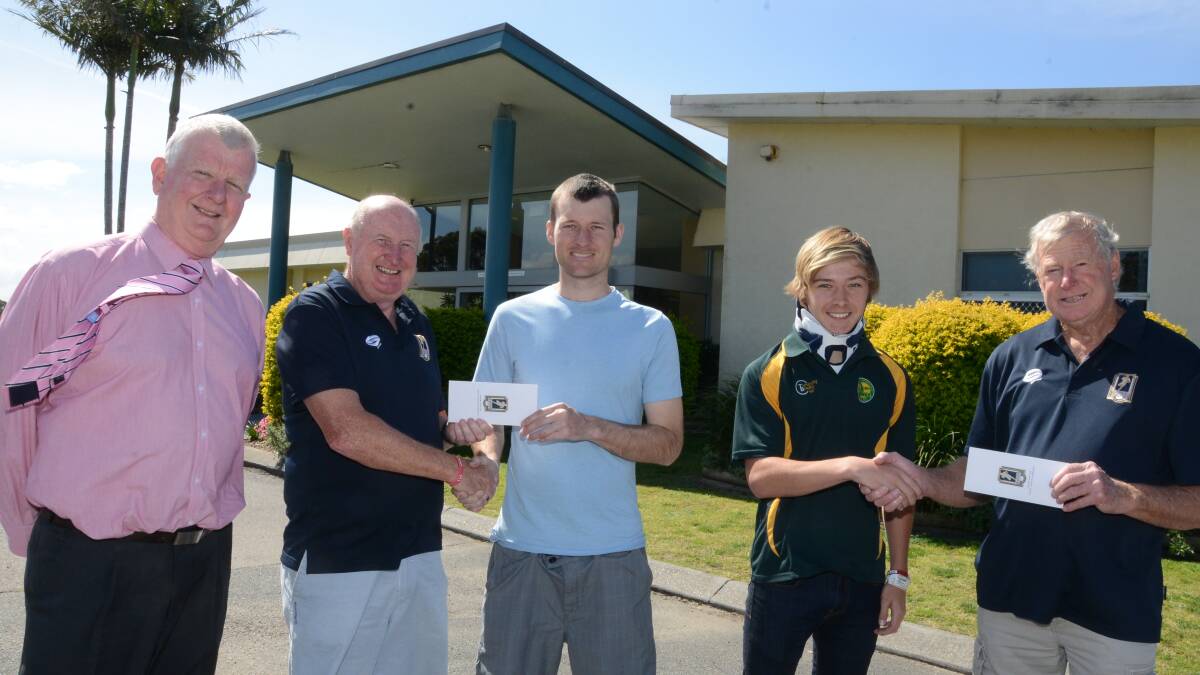 NICE GESTURE: Men of League members Chris Turner, Mick Stone and Dennis Tutty present two cheques to Jared Wynter and Curtis Landers at the Forster Golf Club on Monday.  