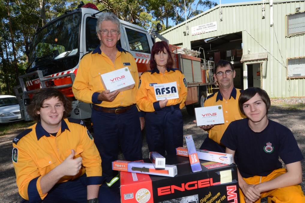 Some of the Pacific Palms Rural Fire Brigade crew; Brendon Lewis, Mark Brown and Mignon, Russell and Chris Gardner. The brigade recently received some vital fire fighting equipment.