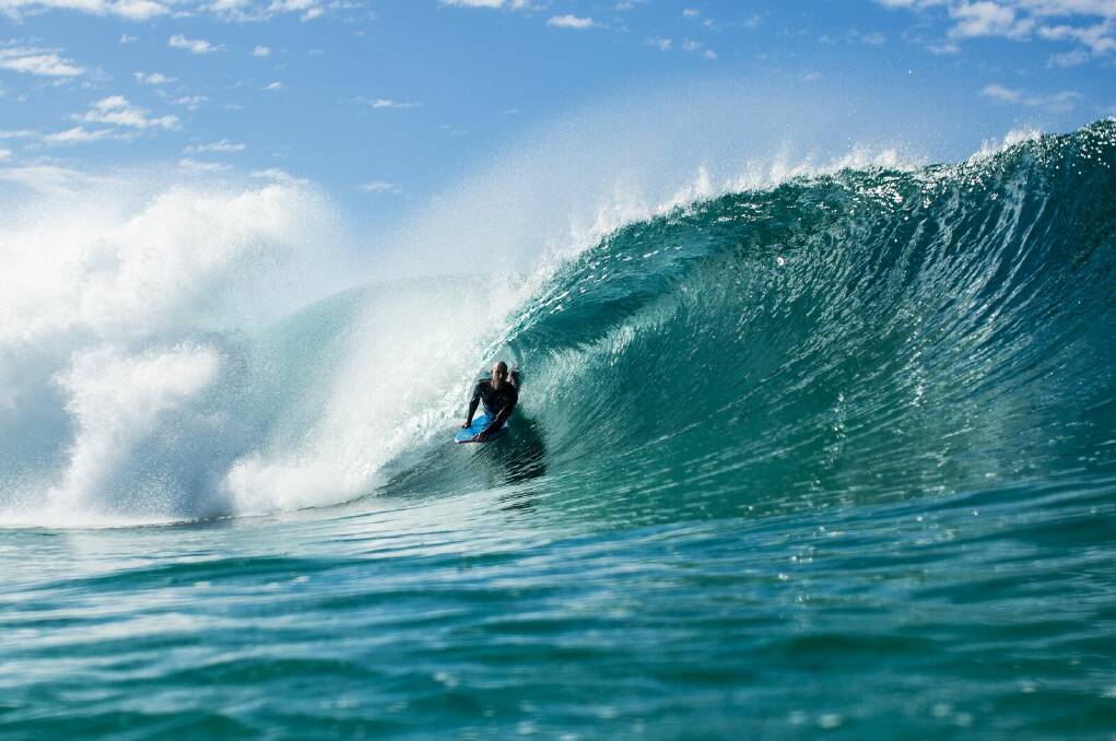 Mike takes to the water. He is considered one of the pioneers of professional bodyboarding. Photo: Something Visual. 
