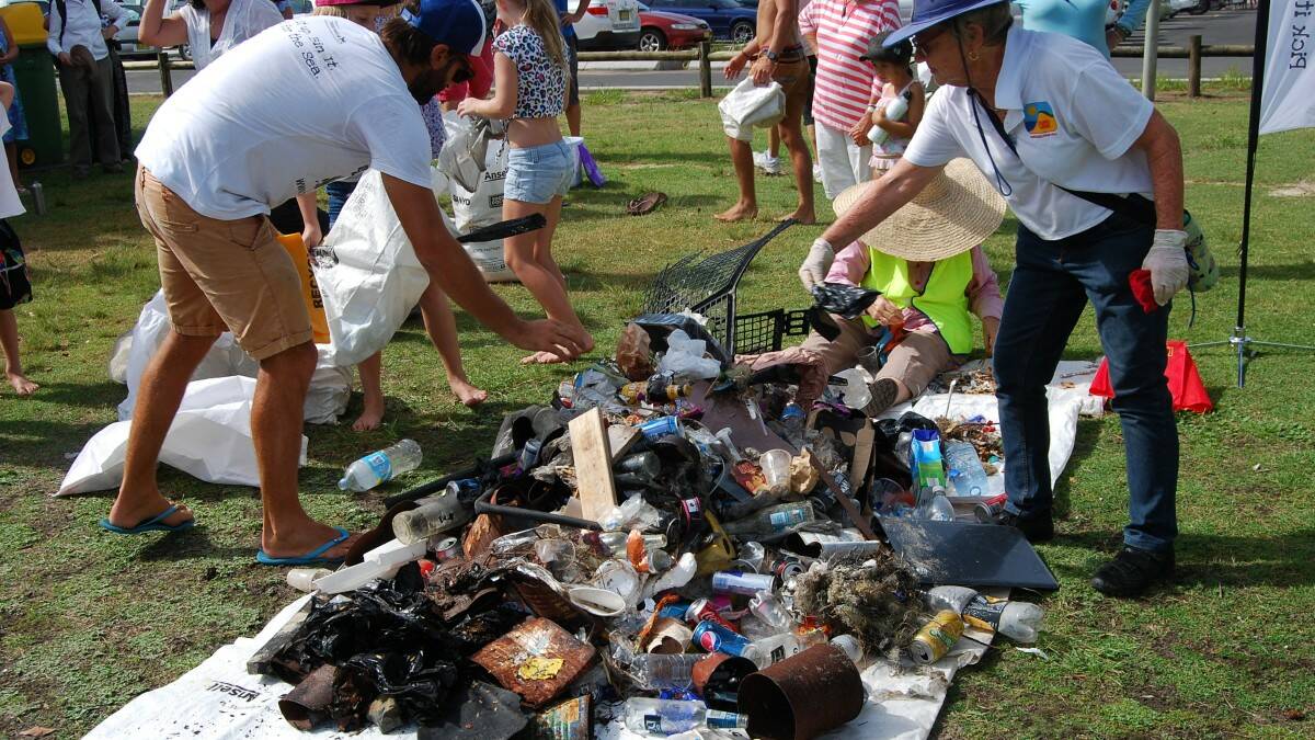 WASTE: volunteers add their collections to the rubbish pile from the cleanup. 