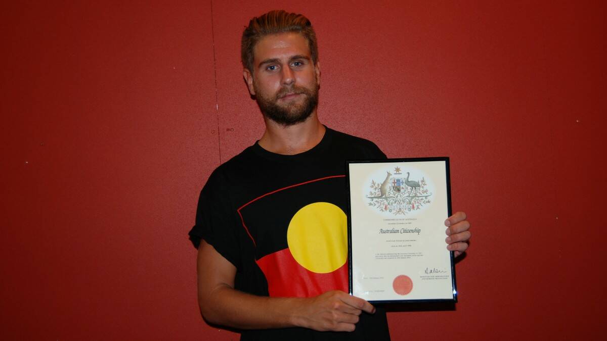 AUSTRALIA DAY AWARDS: new Australian Alistair Klinkenberg from the United Kingdom holds his citizenship certificate