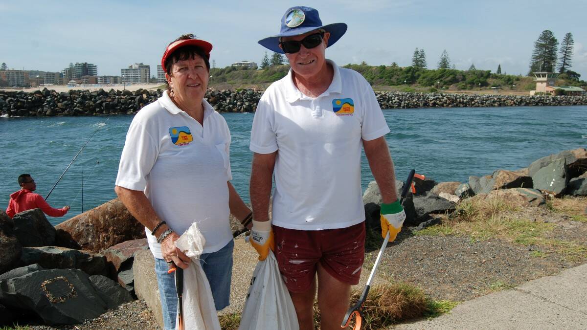 BEACH HELPERS: Janette Thomson and Allan Webb of the Tuncurry Dune Care Group help out at the Talking Trash clean up. 