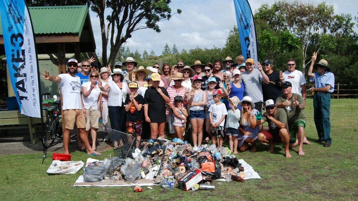 BIG EFFORT: a large group of locals and visitors took part in the Talking Trash beach clean up day at Tuncurry this morning.