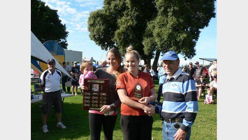 THE BEST: Bob Burns’ granddaughters Ashley and Paige and great granddaughter Jaylee present John Fletcher with the Bob Burns Perpetual trophy for best car on show (above).