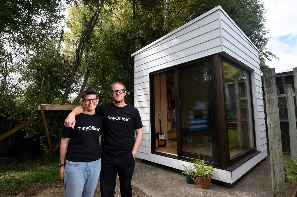 TinyOffice co-founders Matthew Andrews and Jess Kelly outside the prototype office in their backyard. Pictures: Adam Trafford