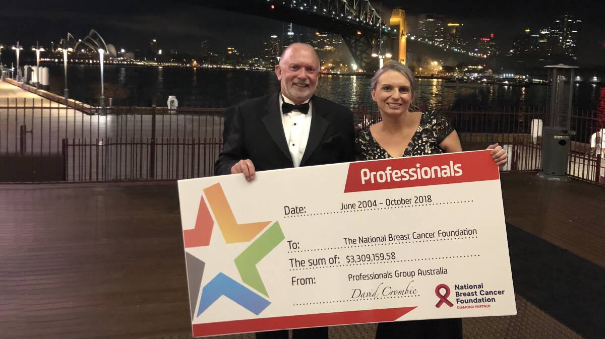 Generosity: Mike Parsons with Faith Stace and The Professionals network's donation cheque to the National Breast Cancer Foundation.
