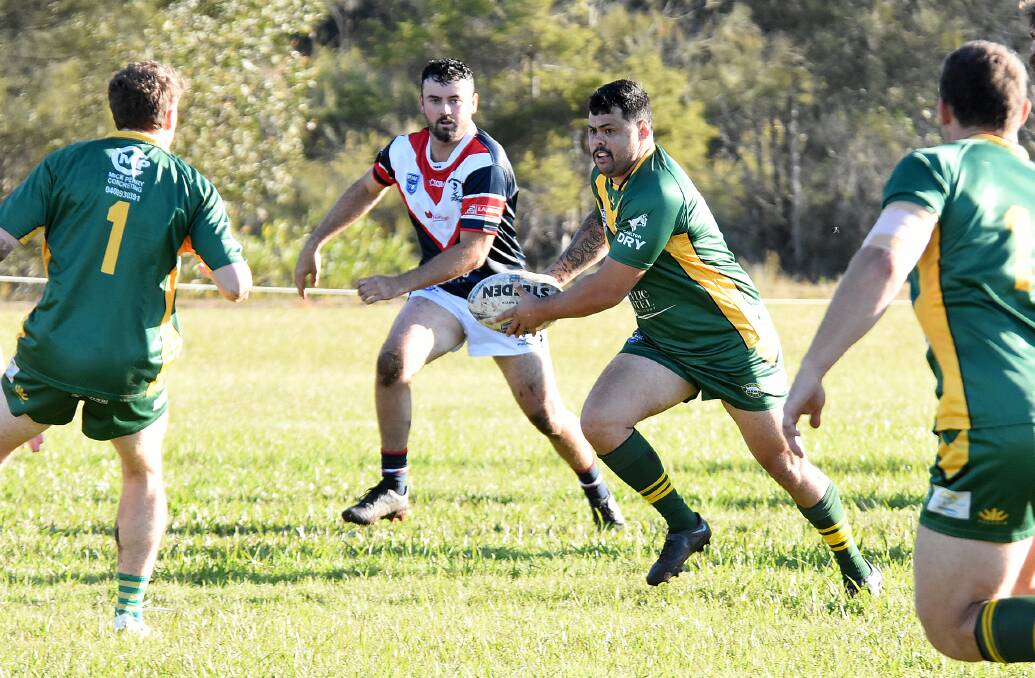 Hawks halfback, Adrian Davis looks to position fullback Jordan Hinton during the clash with Old Bar. The Hawks will be at home to Macleay Valley on Sunday.