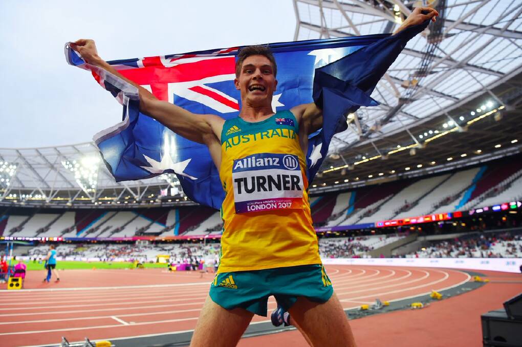 Golden boy: James Turner celebrates after his brilliant win in the 200 metres in London on Tuesday morning.