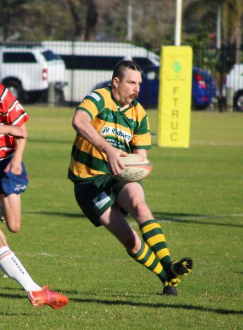 New Forster Rugby Union Club president, Kurt Forester offloads during a Lower North Coast game against Wauchope at Tuncurry. Picture Sue Hobbs.