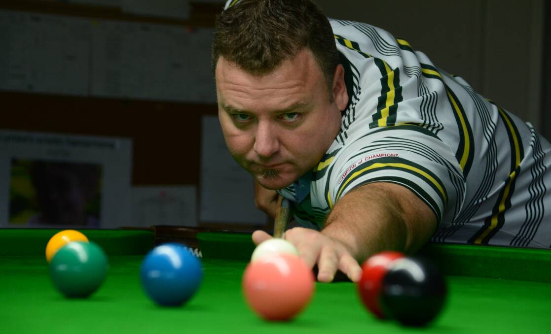 On the table: Club Taree Snooker Club president Simon Magin gets in some practice for this weekend's champion of champions tournament.