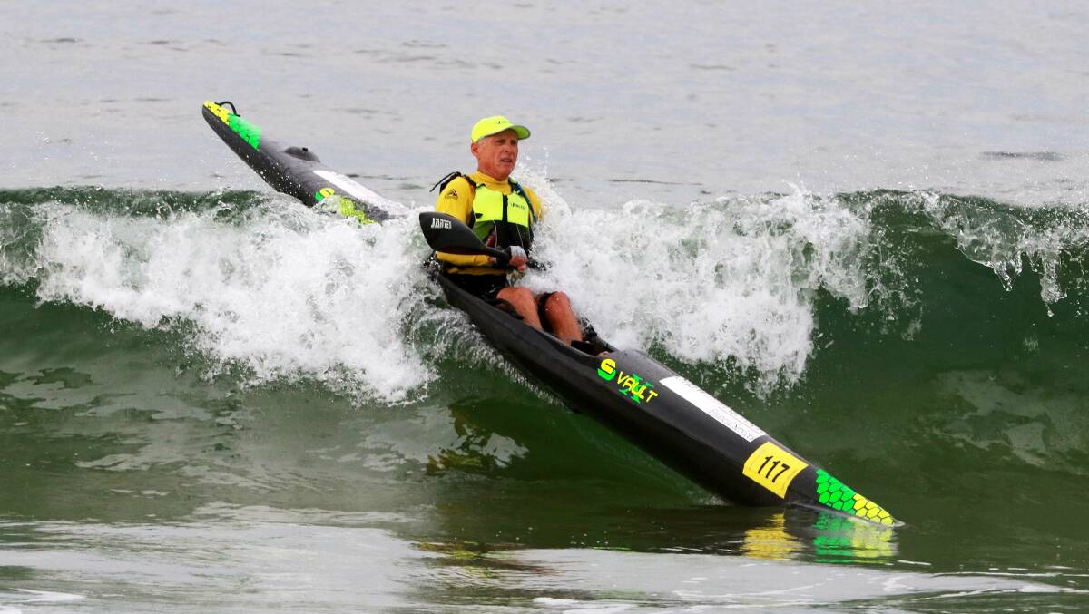Jim Parker negotiates a wave at the conclusion of the Forster Classic on Saturday at Forster Main Beach. 