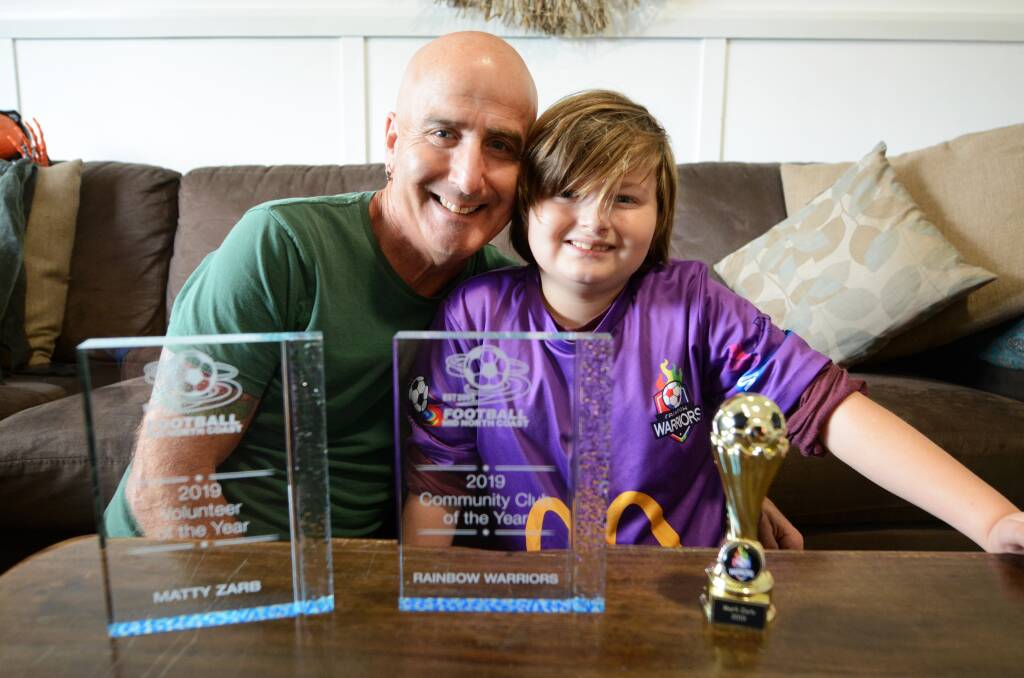Mattz Zarb and his son Marli and the trophies won at the Football Mid North Coast presentation.