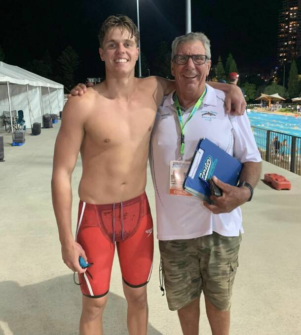 Joel Fleming with coach Peter Sanders after his win in the Australian under 17 50 metres final on the Gold Coast.
