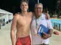 Joel Fleming with coach Peter Sanders after his win in the Australian under 17 50 metres final on the Gold Coast.

