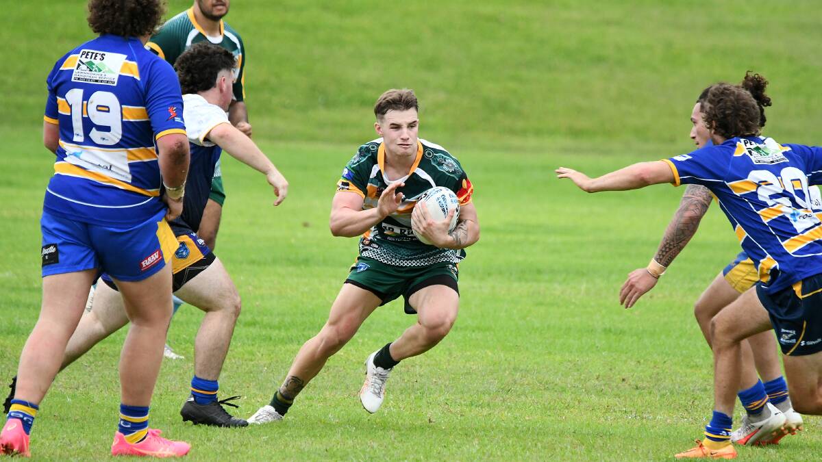Utility back Ashton Hilder looks to go through a gap in the defence during the recent trial game against Avondale.