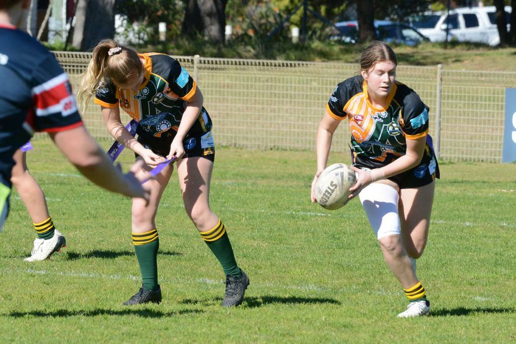 Anika Hudson looks for support playing in a league tag game for the Hawks last year. Forster will now host Wauchope in the opening game of the season on May 7.