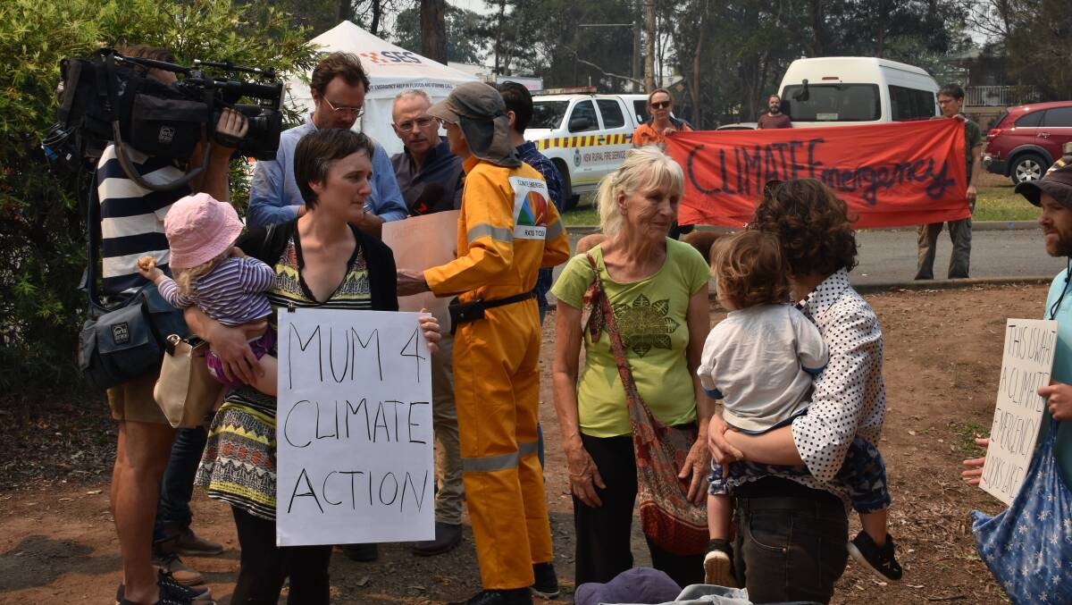 Listen to us: Climate action supporters gathered outside the RFS headquarters in Wauchope on Sunday morning.
