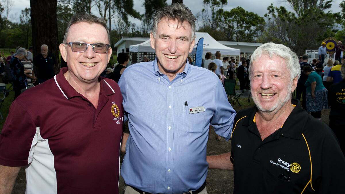 Taree Lions Club's Phil Grisold, NAB chief executive Ross McEwan and Taree Rotary Club's Maurie Stack at the Rainbow Flat service station for a community barbecue post-bushfires in February.