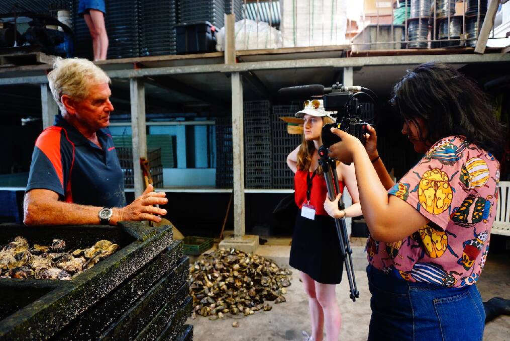 UTS journalism students Alex Turner-Cohen and Soofia Tariq interview oyster farmer Stephen Verdich. Photo by Melanie Wong.