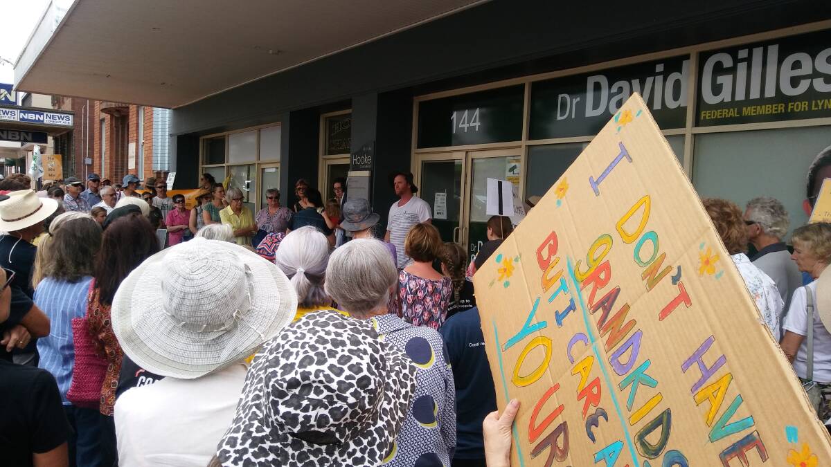 Taree protesters joined a "climate sit-down" in front of federal MP Dr David Gillespie's office late in November. Photo supplied.