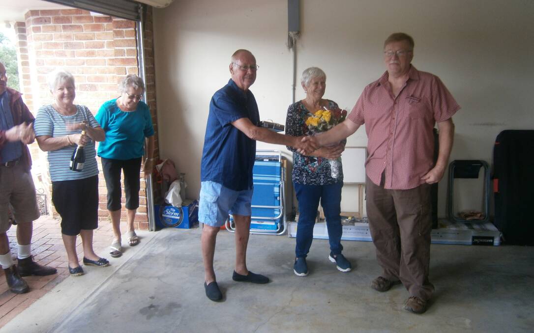 Club president Cliff Stockley of the Great Lakes Historic Automobile Club presented bouquets to Dianne Tipping and Kevin Barnard in appreciation of them making their new home available to the club for their annual Mother's Day lunch.
