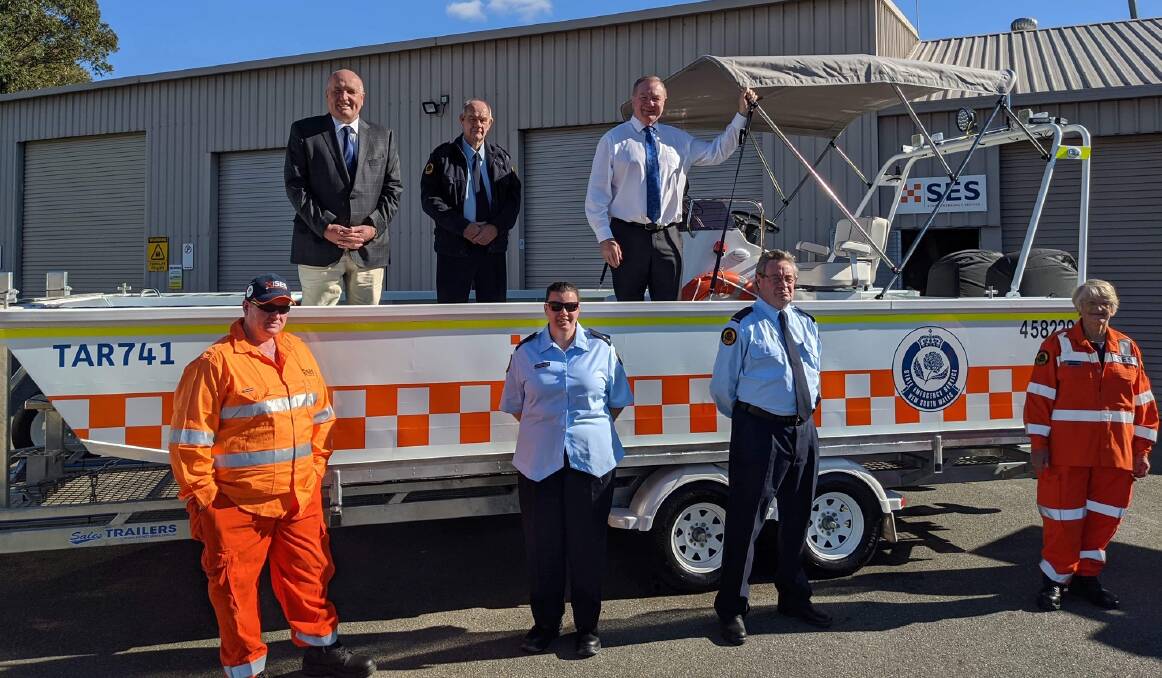 (Back) Minister for Police and Emergency Services, David Elliott, SES unit commander, Glen Laycock, Stephen Bromhead, and (front) Taree City SES members, Rick Clarke, Susan Pietrowiec, Roger Marmion and Hellen Crittenden