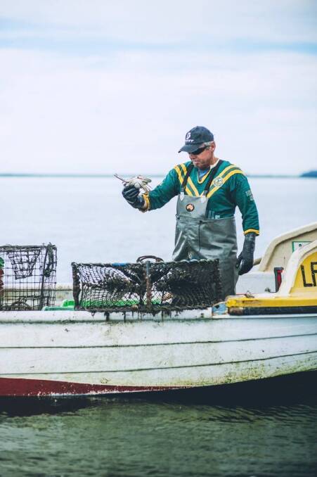 Danny Elliott on his boat fishing for crabs.