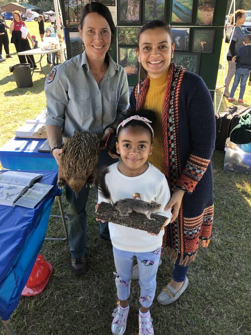 Seven-year-old Maryam Taylor, with her mum Dina Elshahat, was treated to a special exhibit at the National Parks and Wildlife marquee by ranger, Coralie Doangelis.