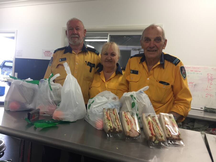Members of the small but dedicated catering staff, caption, Max Morton, Phyllis Morton and senior, John Smith at the Tuncurry RFS kitchen.
