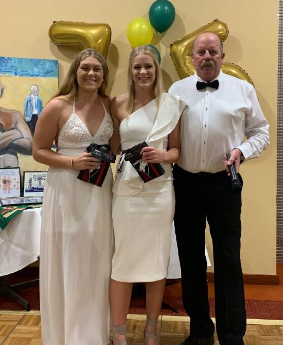 Misty Cornish and Karla Berg is congratulated on their achievements by club president, John Quinn