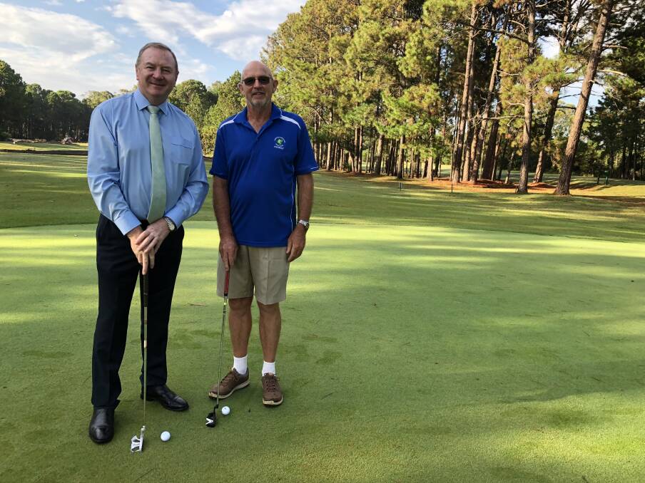 Member for Myall Lakes, Stephen Bromhead and Forster Tuncurry Golf Club president, Pat Bourne inspect the 9th green, site of the new building.