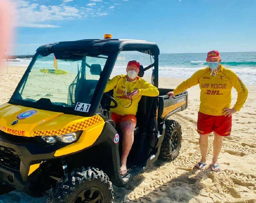 Forster SLSC patrol members, Bruce Higgs and Steve Want inspect the SSV vehicle.